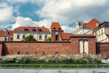 Scenic view of the city of Toruń, Poland, from a bridge, showcasing the city’s historic architecture and riverside beauty