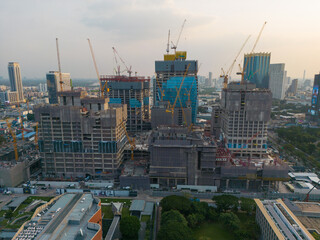 Obraz premium Aerial view construction site building with crane modern office in city park
