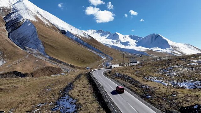 Aerial view with Lorry truck on the road surrounded by winter Landscape