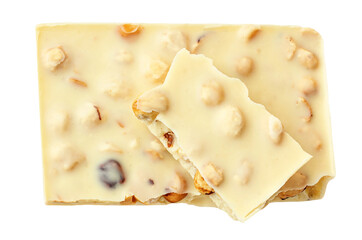 Broken White chocolate pieces isolated on white background. White chocolate bar with hazel nuts Top view, flat lay.