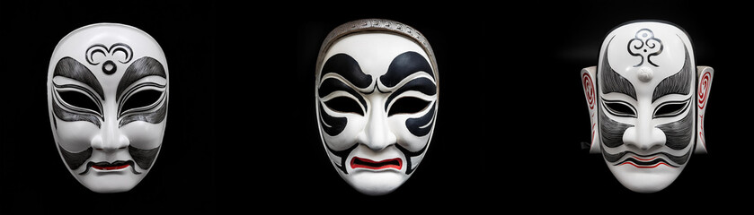 Naklejka premium Three black and white masks with intricate designs are isolated against a black background.