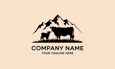 Farm logo with cow and calf silhouette against mountains