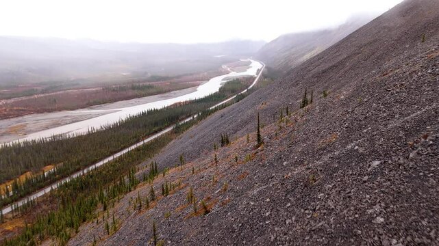 Engineer Creek Along The Dempster Highway From Mountainside In Yukon, Canada. - aerial shot