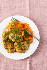 Enjoy a delicious vegetable breakfast with zucchini pancakes topped with fresh zucchini, tomato, and bell pepper caviar, offering a nutritious and flavorful start to your day