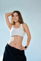 Fototapeta premium A passionate athlete showcases her emotional side while posing confidently in activewear.