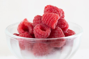 Close-up of raspberry fruit, one and several.