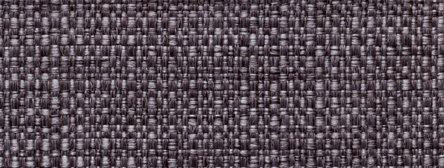 Texture dark brown background from woven textile material with wicker pattern, macro. Structure of umber fabric