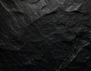 Naklejka premium Dark Stone Texture: Abstract background image of rough, fragmented black stones, ideal for design projects needing a strong, dramatic, and textured aesthetic. 