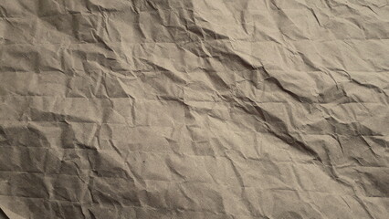 Crumpled beige paper, cardboard. Paper texture. Paper background.