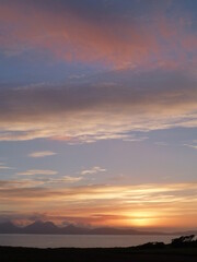 Sunset over the island of Jura, Inner Hebrides, Scotland, as seen from the Argyll coast near Kilberry