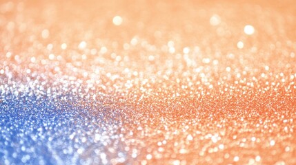 Close-up of blue, orange glitter background with shimmering sparkles.