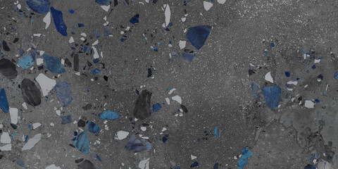 Black and blue terrazzo stones on concrete floor