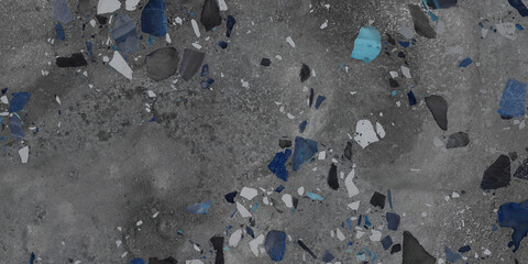 Black and blue terrazzo stones on concrete floor