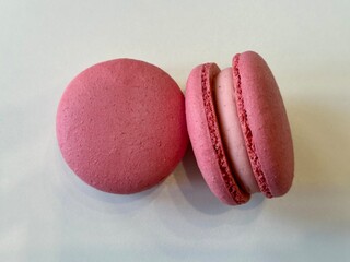 Fresh pink macarons on the white background 