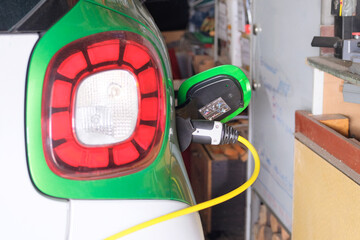 Renewable energy. Eco friendly transport concept. Car electric charger station installed in residential complex. Charger for electric cars. Renewable energy.