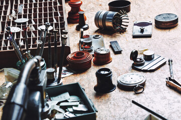 Watchmaker’s organized workspace features tools and components