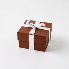 Obraz premium Brown square box with a gold ribbon, against a plain white background