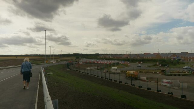 Fly Over Bridge Woman Walks Past at Newsham Train Station Blyth Northumberland