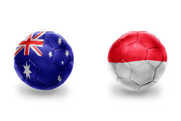 Fototapeta premium football balls with national flags of indonesia and australia ,soccer teams. on the white background.