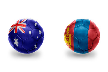 Obraz premium football balls with national flags of mongolia and australia ,soccer teams. on the white background.