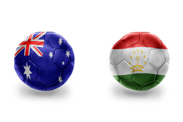 Obraz premium football balls with national flags of tajikistan and australia ,soccer teams. on the white background.