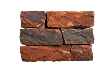 Red stone wall made of textured bricks, isolated on white background.