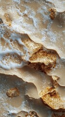 Obraz premium Smooth sandy texture with gentle water ripples reflecting natural patterns in a coastal setting