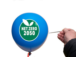 Net zero and carbon neutral concept.Net Zero text on a balloon with 2050 missed target on white...