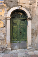 Old green medieval wooden door