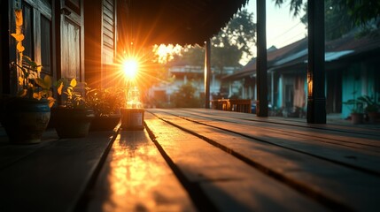  Un tramonto dorato filtra attraverso ampie finestre, proiettando ombre calde sul pavimento e creando un’atmosfera intima e rilassante.
