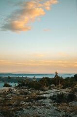 View from the top of the mountain with stones on the Adriatic sea at a beautiful bright sunset 