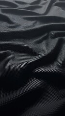 Naklejka premium Close-up view of textured black fabric, showcasing elegant folds and intricate patterns.
