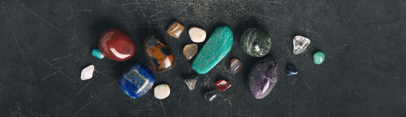 Mystical Flat Lay of Sage, Crystals, and Dried Herbs on Dark Surface banner