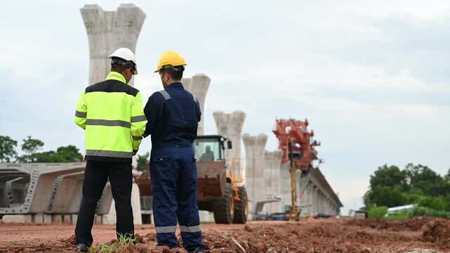 High-Speed Rail Bridge Construction, Engineers at Work on Motorway Construction Site, Planning and Problem Solving, Innovative Technology in Large-Scale Bridge Building