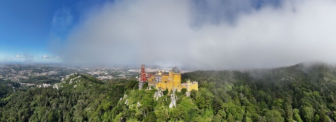 Lisbon, Portugal - July 9 2024 - Sintra Palace aerial drone panorama in the clouds