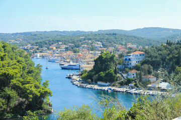 View of Gaios Port on Paxos Island: Boats, Houses, and Lush Nature Landscape