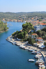 View of Gaios Port on Paxos Island: Boats, Houses, and Lush Nature Landscape