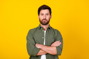 Photo of nice young man folded arms posing wear shirt isolated on yellow color background