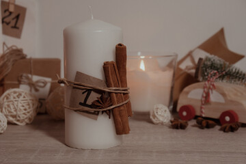 Candle with advent calendar Traditional Burning Christmas Wax Candles with numbers counting down for Christmas. Beautiful Advent At Home. Festive Candlelight And Dark Background. Christmas eve
