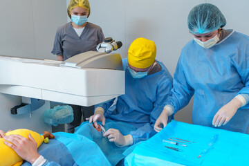Medical Team Conducting Laser Eye Surgery with Precision