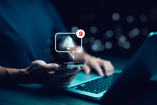 man  hold smartphone and press the button of Notification bell button on smartphone app screen close up,App Notification on Smart Phone Screen, Remote online alerts, home security signal.