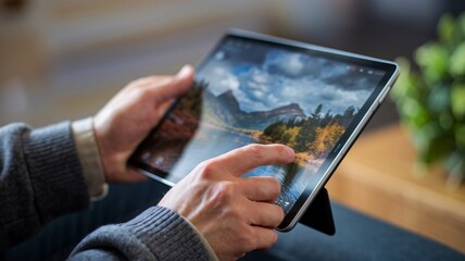 Close-Up of Hands Using Digital Tablet Touchscreen Interface Display