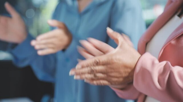 Happy business people clapping hands thanking coach for interesting lecture. Diverse male and female audience giving round of applause to express respect and gratitude to speaker. Banner background