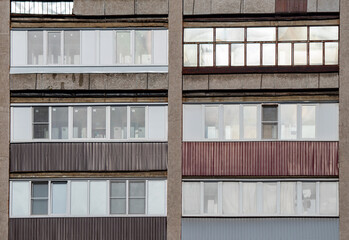 A row of buildings with different colored windows