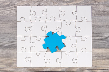 White and blue puzzle. Symbol of Autism Spectrum Disorder. Autism Awareness Day