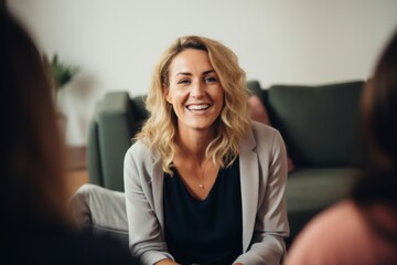 Middle aged female therapist conducting a group session
