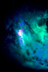 Northern lights dancing over dark space in north of Sweden.