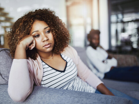 Frustrated couple, argument or ignore with fight for disagreement or living room dispute at home. Upset, woman and man with breakup, divorce or seperation for toxic relationship or cheating affair