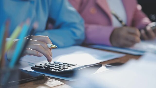 Accounting company provide finance and taxation planning for profitable cash flow, Auditor and accountant team working in office, analyze financial data and accounting record with calculator.Insight