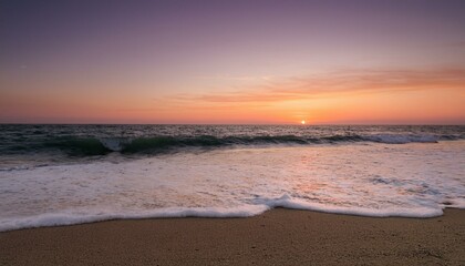 Fototapeta premium Waves on the beach at red sunset